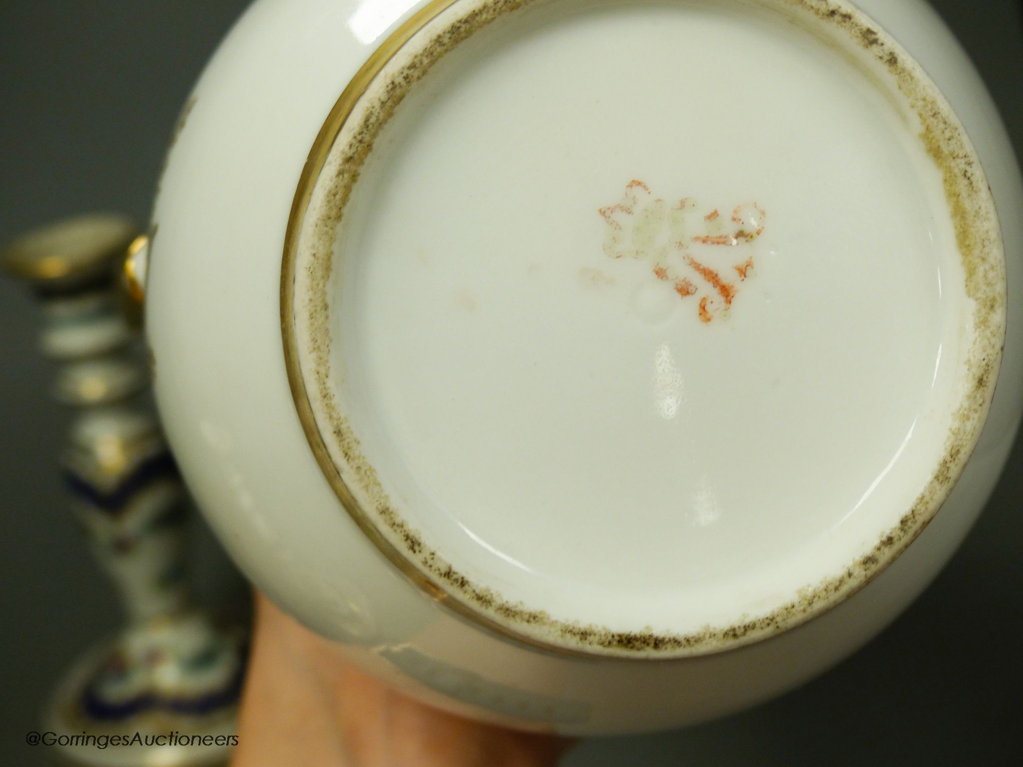 A 19th century Paris porcelain coffee pot and a pair of Dresden candlesticks, tallest 24cm